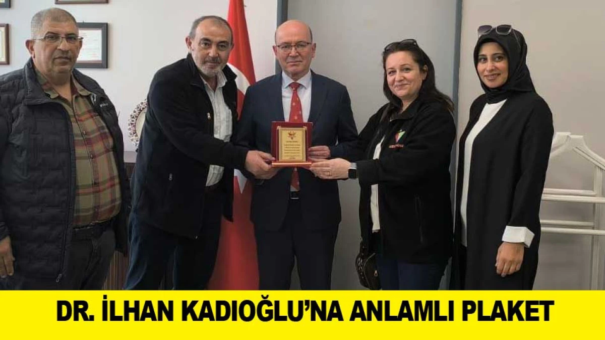 DR. İLHAN KADIOĞLU&rsquo;NA ANLAMLI PLAKET